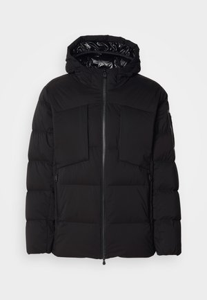 Black puffer jacket made of smooth nylon, featuring a front zipper, large chest pockets, and a hood. Padded for insulation and comfort.