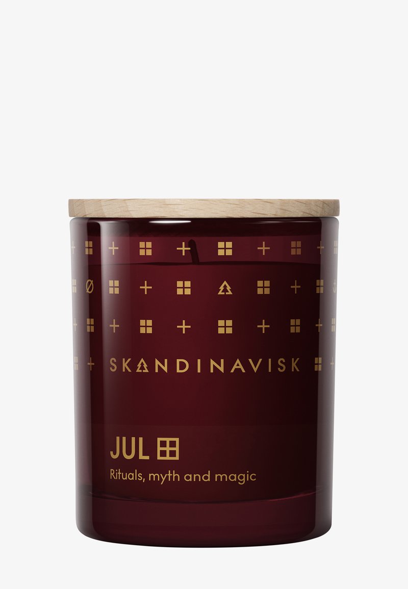 Bocal de bougie rouge foncé avec couvercle en bois, motifs scandinaves dorés et texte "JUL - Rituels, mythes et magie" à l'avant.