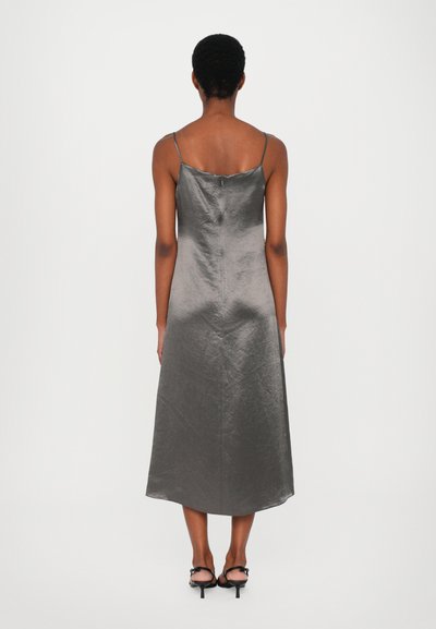 Silky, gray midi dress with thin straps, a straight fit, and an asymmetric hem. Satin-like texture with a concealed back zipper detail.