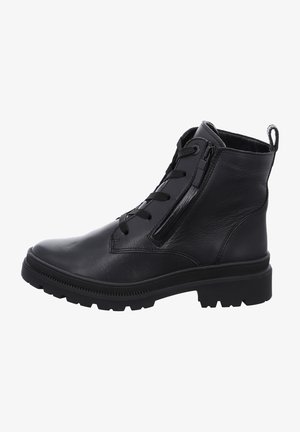Bottines en cuir noir avec une surface texturée, dotées d'une fermeture éclair à l'avant, d'un laçage et d'une semelle en caoutchouc robuste.