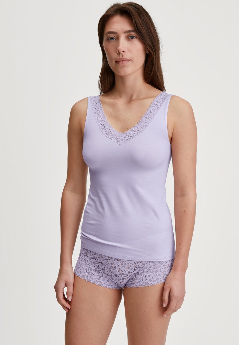 Lavender tank top with lace trim along the V-neck and matching lace shorts. Soft fabric and delicate floral pattern on shorts.