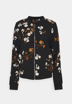 Veste noire zippée avec imprimé floral blanc et marron, col, poignets et ourlet côtelés.