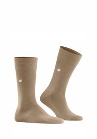 Beżowe skarpetki bawełniane z prążkowanymi ściągaczami, gładką fakturą, do kolan i małym białym logo z boku.