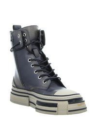Navy leather high-top sneaker with front laces, side zipper, and textured sole. Features a white toe cap and layered platform in beige and black.