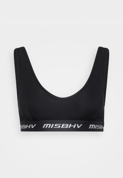 Black sports bra with wide straps, a scoop neckline, and a thick elastic band featuring white "MISBHV" branding. Smooth, stretchy fabric.