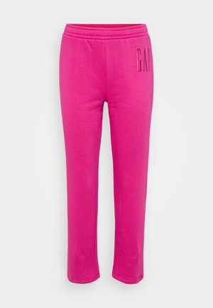 Ružové tepláky s elastickým pásom a rovnými nohavicami. Na boku majú embosované logo "GAP". Vyrobené z mäkkého, ľahkého materiálu.