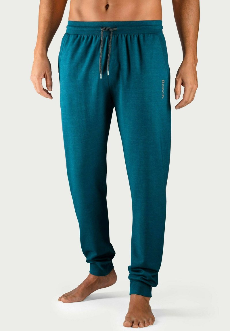 Türkise Jogginghosen mit elastischem Bund und Kordelzug, ausgestattet mit Seitentaschen und gerippten Bündchen, mit "Bench"-Logo in Grau beschriftet.