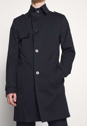 Donker marineblauwe trenchcoat met een dubbelgebreide ontwerp, voorzien van grote knopen, een klassiek kraag en zijzakken. Glad, lichtgewicht materiaal.