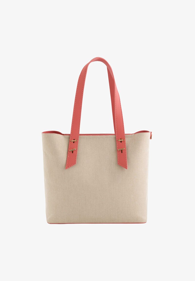 Beige canvas tote bag with coral faux leather handles, gold hardware accents, and a structured rectangular shape. Soft, textured finish.