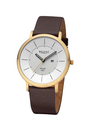 Montre ronde en or avec cadran blanc, index noirs, bracelet en cuir marron, affichage de la date à 3 heures, et texte "Regent Solar vegan" sur le cadran.