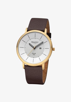 Montre ronde en or avec cadran blanc, index noirs, bracelet en cuir marron, affichage de la date à 3 heures, et texte "Regent Solar vegan" sur le cadran.