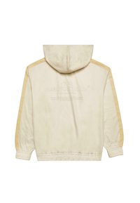 Giacca beige con cappuccio e strisce laterali. Presenta polsini e orlo elasticizzati, una texture morbida e un dettaglio con logo in stampa fine sul retro.