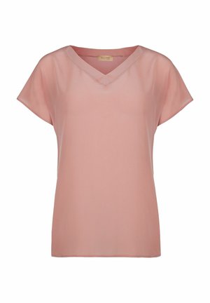 Haut à manches courtes et décolleté en V en tissu rose pâle. Matériau léger avec une texture lisse et une coupe décontractée. Design simple, sans motifs ni accents.