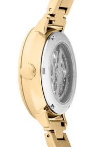Orologio in acciaio inossidabile dorato con retro trasparente, che mette in mostra ingranaggi intricati, finitura lucida e design della cassa curvata.