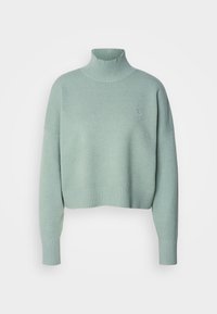Mint green cropped sweater with a high ribbed collar, wide ribbed cuffs, and a small embroidered logo on the chest. Soft knit material.
