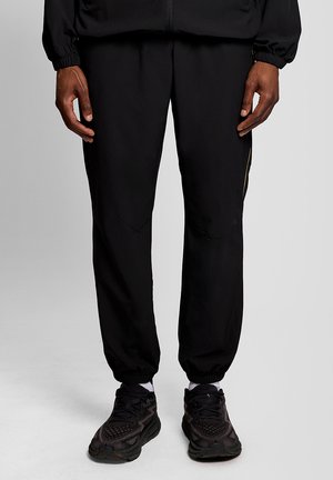 STRIPED TRACKIES - Trainingsbroek - z jet black
