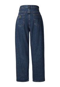 Jeans de mezclilla azul oscuro de cintura alta con un ajuste holgado, que cuentan con dos bolsillos traseros y una etiqueta con el logo en la pretina.