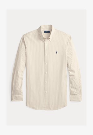 Camicia a maniche lunghe a righe beige e bianche con bottoni. Presenta un colletto a punta e un dettaglio logo blu navy sul petto sinistro. Realizzata in cotone.
