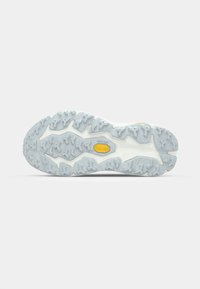 Trail running shoe outsole with a textured gray rubber surface. Features a distinctive zigzag tread pattern and a yellow Vibram logo.