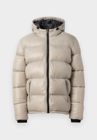 Pufferjack in licht beige, met een capuchon, voorrits en twee ritszakken aan de zijkant. Geweven quiltontwerp met elastische manchetten.