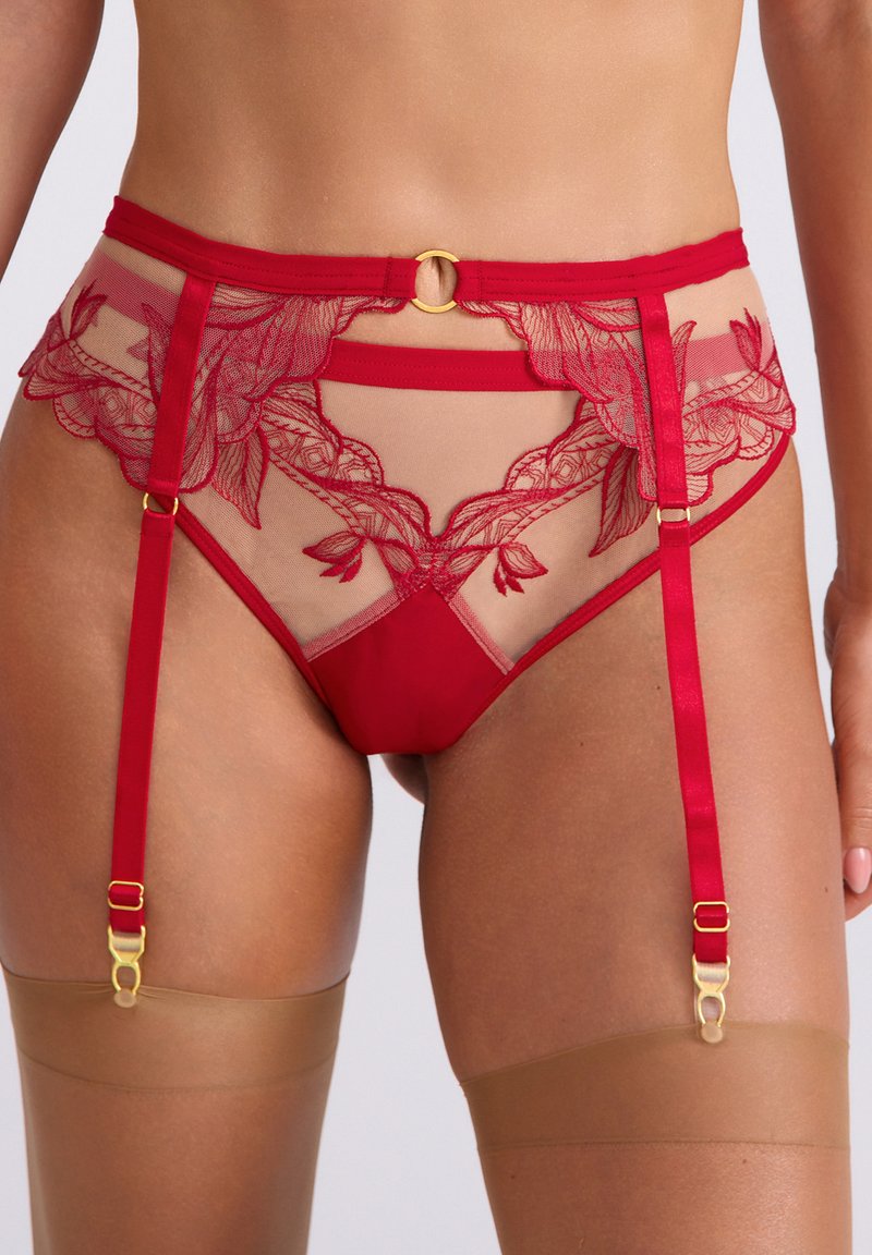 Czerwona koronkowa i siateczkowa podwiązka z haftem kwiatowym, złotymi akcentami, regulowanymi paskami oraz dołączonymi przezroczystymi beżowymi pończochami.