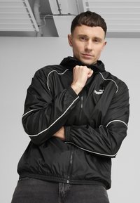 Puma SPORT  - Windbreakers - black