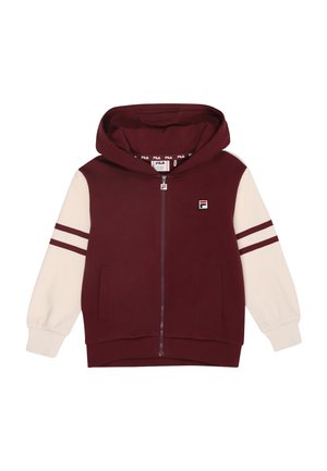 Mörkröd zip-up hoodie med krämfärgad huva och ärmar, med röda ränder på ärmarna och en logotyp på bröstet. Slät textur.