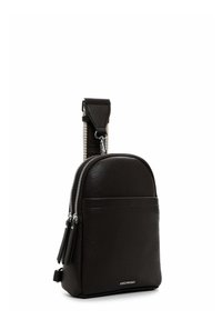 Kompaktne must nahast rihmkott kahe tõmblukuga taskuga, lai beež-must reguleeritav rihm ja hõbedased detailid.