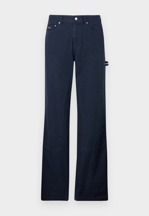 Marineblå bomullsbukser med rette ben, som har frontlommer, sømdetaljer og en side sløyfe for verktøykobling.