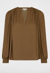 Blusa marrone a maniche lunghe con scollo a V, spalle arricciate e polsini smockati. Realizzata in tessuto morbido con una vestibilità rilassata.
