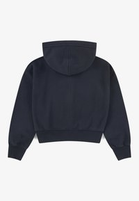 Sudadera corta navy con capucha amplia, puños y dobladillo acanalados. Tejido suave con una textura lisa y uniforme. Sin patrones ni logotipos visibles.