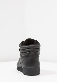 reebok tempo slip on