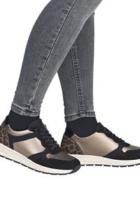 Black and metallic gold sneakers with a leopard print accent, featuring a textured finish, lace closure, and a cushioned sole.