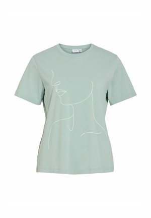 Lysegrøn t-shirt med korte ærmer med enkel hvid stregtegning af en kvindes ansigt og hals på forsiden.