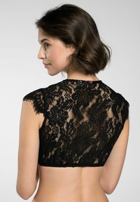 Schwarzes Spitzen-Croptop mit Blumenmuster, kurzen Ärmeln, gewellten Kanten und einer strukturierten Oberfläche, die ein aufwändiges Design zeigt.