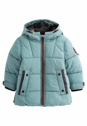 Veste d’hiver matelassée bleu clair avec capuche doublée en polaire foncée, fermeture zippée devant, deux poches à boutons-pression et sangles ajustables aux poignets.