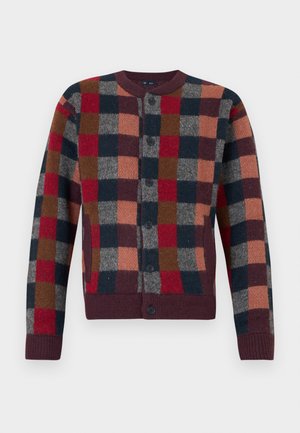 Button-up knitted cardigan with a multicolor checkered pattern in red, navy, brown, gray, and peach tones with ribbed cuffs and hem.