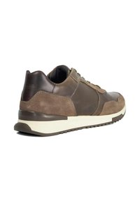 Brown suede and leather athletic shoe with a sturdy rubber sole, rounded toe, and padded collar; features stitched accents and lace closure.