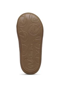 Brun gummisula med ett texturerat mönster som har en stiliserad logotyp och cirkulära motiv, som ger grepp och flexibilitet.