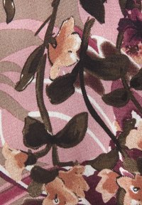 Abstract floral fabric featuring pink and brown tones, with textured leaves and flowers, against a backdrop of swirling lines.