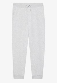 Graue Sweatpants aus weichem Stoff, mit einem Kordelzugbund, seitlichen Taschen und zulaufenden Beinen mit gerippten Bündchen.
