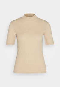 Haut beige à manches courtes avec col roulé en tissu côtelé, présentant une coupe ajustée et une texture lisse, avec des coutures discrètes et une finition soignée.