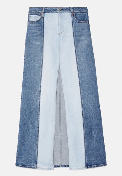 Denim skirt featuring three shades of blue, with a split front design and contrasting panels. Classic waistband with button closure.