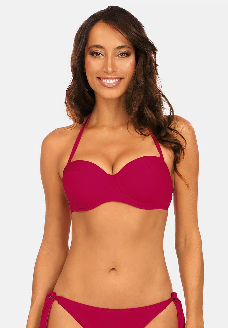 Różowy biustonosz bikini z fiszbinami i regulowanymi ramiączkami. Gładka faktura i profilowany krój zapewniający wsparcie. Bez wzorów i akcentów.