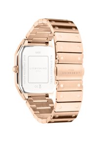 Klocka i rosguld av rostfritt stål med fyrkantig urtavla, en polerad yta och en länkarmband med runda detaljer samt en vattentät baksida.