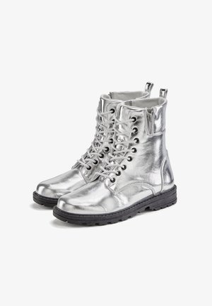 Silver metallic ankle boots with a textured leather finish, featuring black rubber soles, lace-up design, and side zip for easy wear.