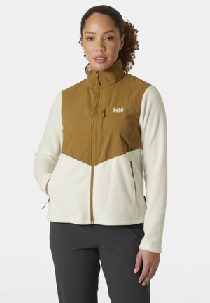 Fleecejack met een bruine bovenkant en een crèmekleurige onderkant. Voorzien van een ritssluiting op de zakken aan de voorkant en een hoge kraag. Logo op de borst. Zachte textuur.