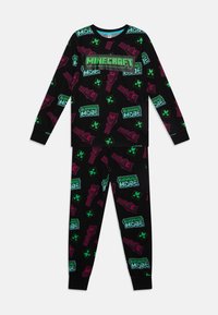 Minecraft-teemainen musta pyjaman setti, jossa on värikkäitä kuvastoja ikoneista ja tekstistä vihreänä ja vaaleanpunaisena, valmistettu pehmeästä, kevyestä kankaasta.
