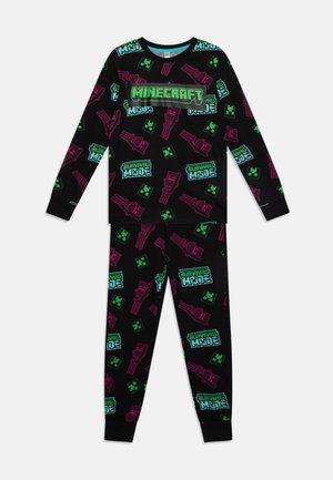Minecraft-temat svart pyjamasset med färgglada grafik av ikoner och text i grönt och rosa, tillverkat av mjukt, lätt tyg.