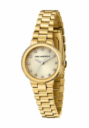 Orologio color oro con cinturino a maglie metalliche, cassa rotonda e quadrante a effetto sunburst con indicatori delle ore in diamante e testo del logo.